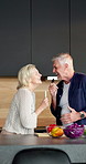Cooking, cutlery and sing with old couple in kitchen of home together for bonding or meal prep. Dance, food and microphone with senior people in apartment for fun, healthy eating or laughing