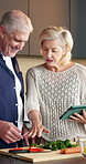 Kitchen, cooking and old couple with tablet for vegetable recipe, organic guide and talk in retirement. Tech, senior man and happy woman with meal prep, vegan ingredients and online tutorial at home