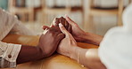 Holding hands, love and couple in home for care, comfort or bonding together in living room. Support, empathy and people for connection with commitment, hope or marriage with compassion in apartment