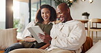 Streaming, tablet and couple on sofa with laugh, funny series and comic post on social media. Happy, digital or African people in home with tech, comedy show or bonding together with humor connection