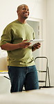 Interior design, thinking or black man in house with tablet, renovation or brainstorming on layout draft. Reflection, smile or architect with tech, restoration plan or improvement insight in remodel.