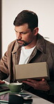 Shipping, man and laptop with box in startup for inventory update, log shipment and tracking code. Small business, staff and worker with tech to verify package label, delivery process and logistics