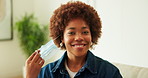 Face, woman and remove mask in home for post illness recovery, infection control and safety. Happy, black person and take off flu protection in house for viral clearance, healing and end of disease