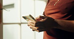 Texting, online and hands with phone in home, chatting or communication with contact on social media. Typing, message and person with mobile, internet connection and networking with tech in house