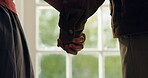 Couple, holding hands and bonding with partner, home and commitment for relationship and connection. Love, assurance and comfort for spouse with gesture, marriage and people with loyalty in house