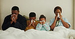 Sick, tissue and sneeze with black family in bedroom for allergy, cold season and virus recovery. Disease, blowing nose and illness with parents and children in home for viral infection and flu