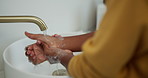 Faucet, person and washing hands with soap in bathroom for germ removal, disinfection and cleanliness. Hygiene, water and cleaning dirt in sink for bacteria safety, healthcare and wellness in home
