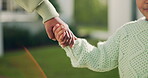 Love, mother and child holding hands in backyard for outdoor safety, parenting and support. Family, mom and kid with bonding together at house for trust, development guidance and security in garden