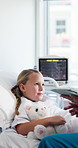 Tablet, nurse and child in hospital bed for consulting, medical report and talking for checkup. Healthcare, pediatrician and girl with person on tech for patient review, diagnosis and wellness