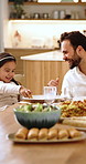 Smile, father and child in home with food, healthy meal and bonding together for lunch. Happy, man and talking at house with daughter, giving samosa and nutrition diet with weekend feast for brunch