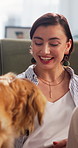 Happy, relax and woman with dog in home for bonding, companionship or adoption in living room. Smile, connection and female person with golden retriever puppy for loyalty, safety and care in house.