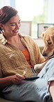 Happy, home and woman with treats for dog for bonding, learning skills and training together on weekend. Pet, sofa and person with Golden Retriever with reward for trust, connection and affection