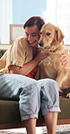 Happy, hug and woman with dog on sofa for bonding, relationship and connection on weekend. Home, pet and person with Golden Retriever for embrace, affection and love for trust, loyalty and care