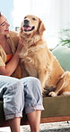 Smile, hug and woman with dog on sofa for bonding, relationship and connection on weekend. Home, happy and person with Golden Retriever for embrace, love and relax for trust, loyalty and affection
