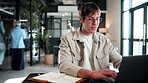 Business, man and typing on laptop in office for publication feedback, editing process and email. Creative, editor and tech at publishing agency for article comments, fact check story and submission
