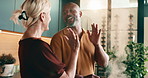 Happy, cooking and love with high five in kitchen for meal prep, success or recipe together in home. Interracial couple, smell and pot with smile for culinary skill, nutrition or teamwork in house