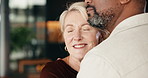 Love, hug and couple in home with bonding, connection and happiness in marriage together on weekend. Smile, care and mature man with woman with support, trust and romance in living room at apartment.