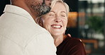 Happy, hug and couple in home with bonding, connection and love in marriage together on weekend. Smile, care and mature man with woman with support, trust and romance in living room at apartment.