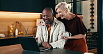 Coffee, laptop and couple in kitchen at house for reading online blog on finance tips or advice. Happy, computer and mature man hug woman for financial planning with bonding and connection in home.