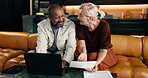 Finance, laptop and paper with interracial couple on sofa in home living room for planning. Budget, computer and financial documents with mature people in apartment for account discussion or review
