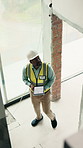 Thinking, black man and engineer at site with tablet screen, blueprint and inspection for architecture. Above, mature person and tech with floor plan, sketch and information for property development