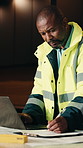 Black man, engineer and document with laptop for construction, research and report for inspection. Mature person, writing and pc at site with checklist, evaluation and information for building safety