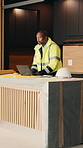 Thinking, black man and engineer with laptop for construction, research and ideas for expansion. Mature person, inspection and tech with checklist, evaluation and information for property development