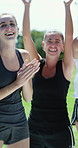 Women, cheering and applause for sport success, happy and excited for win with team and celebration. Outdoor, fitness and people with smile for achievement, clapping and competition victory on field