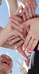 Fitness, women and stack with hands for support, collaboration or solidarity outdoor with blue sky. Team, people and community together for motivation, exercise goal and low angle for synergy