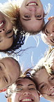 Fitness, women and face with huddle for support, collaboration or solidarity outdoor with blue sky. Team, people and community together for motivation, exercise goal and low angle for synergy