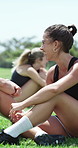Smile, friends and woman on soccer field for fitness, discussion and practice break from match. Happy, people and football at park with conversation, team bonding and communication for sports contest