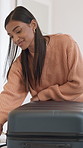 Happy, woman or travel with suitcase in home for holiday trip, commute or packed journey. Female person, traveler or getting ready with smile, passport or bag for vacation, flight or luggage in house