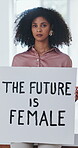 Face, woman and feminism poster in office for empowerment, leadership shift or company equity. Future equality, serious employee or advocacy sign at work for female rights, social change and activism