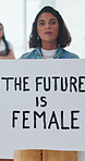 Face, businesswoman and feminism poster in office for empowerment, leadership shift or social change. Future equality, serious person or advocacy sign at work for female rights, inclusion or activism