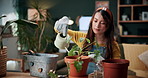 Happy, home and woman with water for plants for maintenance, hobby and floral growth. Eco friendly, house and person with watering can for indoor gardening, botany and healthy leaves for houseplant