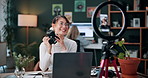 Woman, photographer and vlog with camera or ring light on laptop for live streaming in home. Female person, creative freelancer or vlogger with technology for online tutorial, advice or tips in house