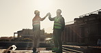Construction, sunshine or men on site with high five, team success or motivation in building project. Flare, space or engineers with collaboration, encouragement or victory in industrial development.