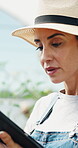Greenhouse, farmer and woman with tablet, agriculture and crop management on web and sustainability. Happy, mature person and monitor climate for plant growth, scroll and research with tech in farm