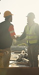 Shaking hands, deal and construction workers on site for city planning, agreement or negotiation. Contract, handshake and civil engineers with partnership for building development in urban town.