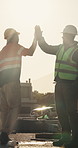 Celebration, team or men with high five at construction site, development milestone or foundation done. Outdoor, target or people with support for labor, infrastructure progress or property building