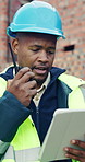 Tablet, black man and radio on construction site with conversation for building, renovation or repairs. Safety, feedback and civil engineer with digital tech for inspection update or risk assessment