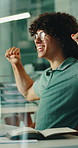 Work, excited and man with fist pump, win or promotion achievement with computer in software startup. Yes, success and happy person in glass office for victory, programming bonus or clap to celebrate