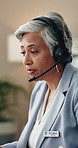 Woman, doctor and talking in office with headset, consultation and discussion for medical advice. Mature person, consulting and workplace with mic, communication and telehealth for patient treatment
