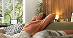 Peace, stretching and woman relax on sofa in home, calm and resting after remote work in living room. Couch, break and freelance person with comfort, self care and breathing for stress relief