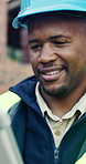 Tablet, black man and smile on construction site with approval for building, renovation or repairs. Safety, feedback and civil engineer with digital tech for inspection update or risk assessment
