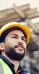Building, hard hat and thinking with man on construction site for engineering or property development. Architecture, helmet and inspiration with industrial worker outdoor for planning or vision