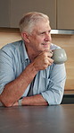 Thinking, kitchen and senior man with coffee, reflection and planning day with inspiration in home. Happy, house and elderly person with drink for nostalgia, memory and thoughtful on weekend morning