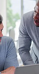 Men, talking and teamwork with laptop in business, online or financial planning with research on web. People, discussion and colleagues with tech, collaboration and investment opportunity in office