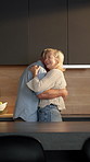 Dancing, happy and senior couple in kitchen for bonding, relationship and connection in home. Marriage, spin and elderly man and woman with music, movement and embrace for affection, trust and love