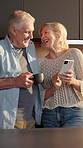 Laugh, coffee and couple with phone in home for internet meme, funny online video and bonding. Tea, mature people and happy with mobile in kitchen for reading comic status, healthy marriage and joke
